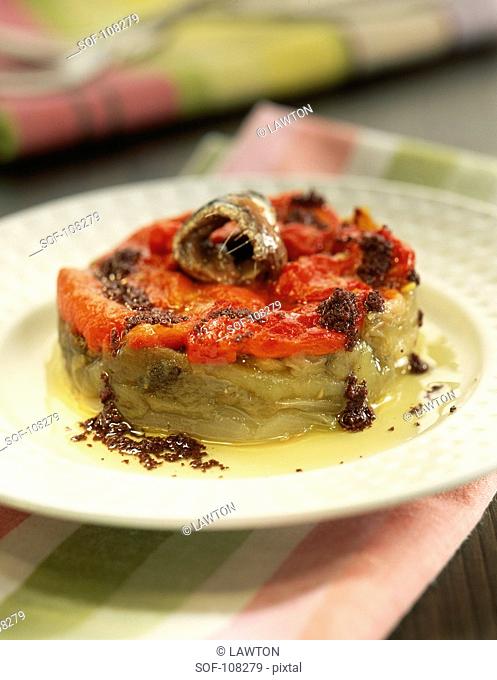 Escalivada with red peppers , anchovies and olives