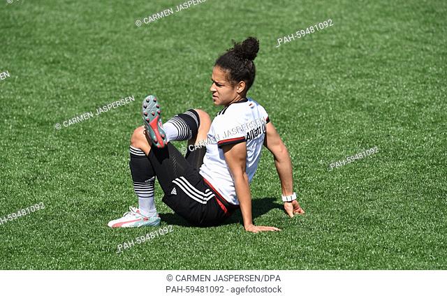 Germany's Celia Sasic stretches during a training session at at the FIFA Women's World Cup 2015 at the Avenue Bois-de-Boulogne, Laval in Montreal, Canada