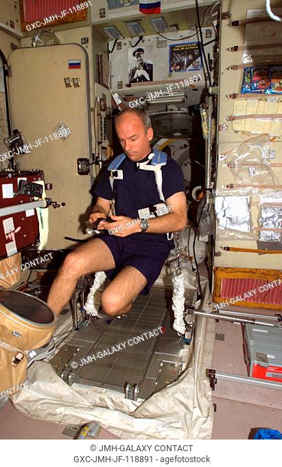 Astronaut Jeffrey N. Williams, Expedition 13 NASA space station science officer and flight engineer, prepares to exercise on the Treadmill Vibration Isolation...