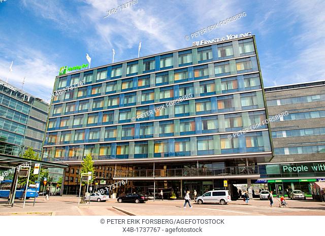 Building housing a Holiday Inn hotel and Ernst and Young financial service office Elielinaukio the Eliel square central Helsinki Finland Europe
