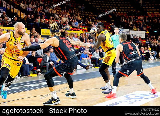 Oostende's Pierre-Antoine Gillet, Brussels' Thomas Hanquiez , Oostende's Damien Jefferson and Brussels' Terry Deroover fight for the ball during a basketball...