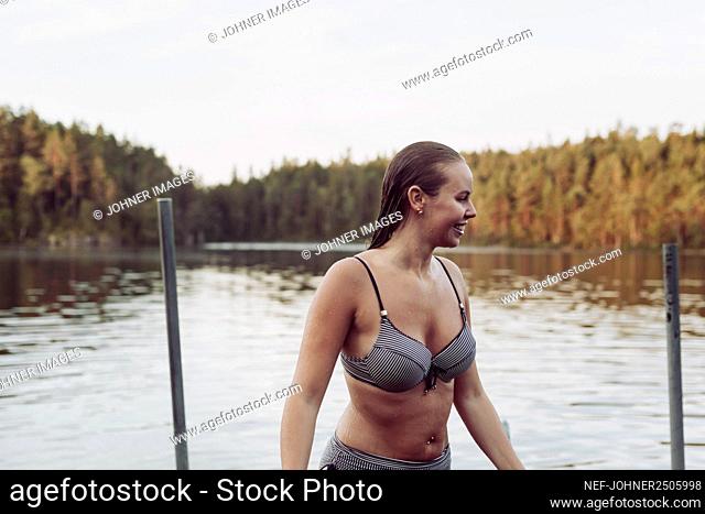 Happy woman at lake