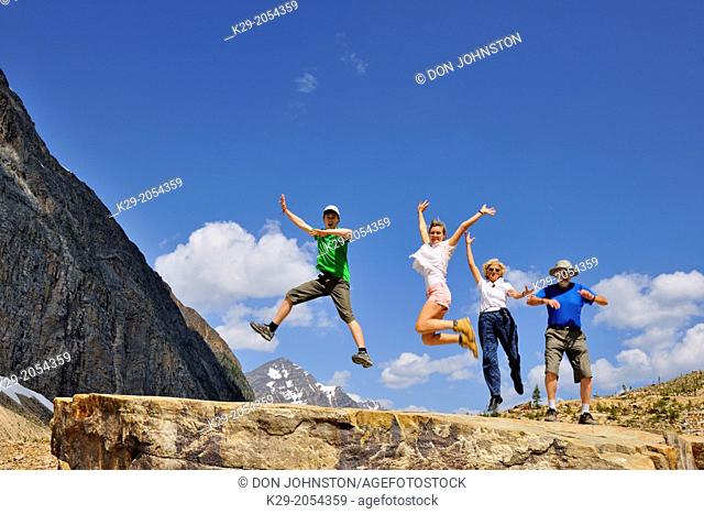 Tourists frolicking below Mt. Edith Cavell, Jasper National Park, Alberta, Canada