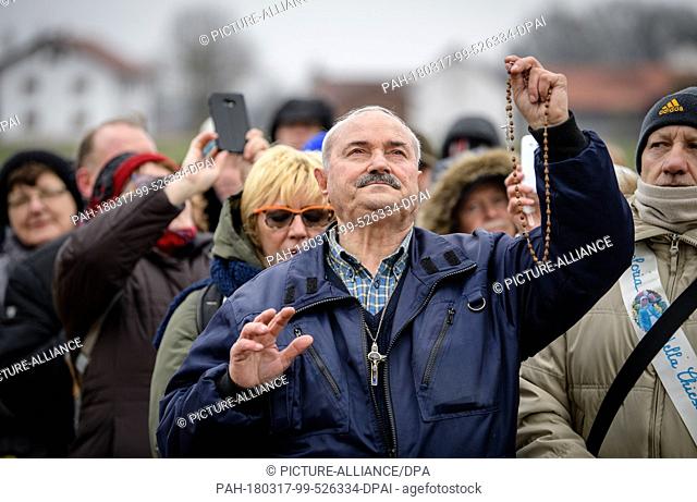 17 March 2018, Germany, Unterflossing: Self-appointed seer, Salvatore Caputa, from Italy looking to the sky during the apparent apperance of the Virgin Mary at...
