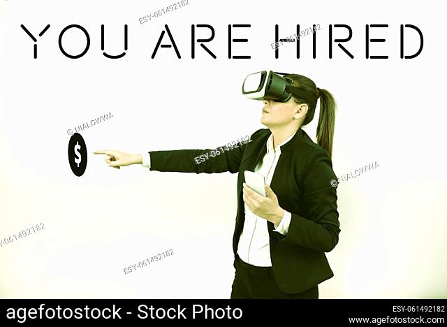 Handwriting text You Are Hired, Word Written on Recruitment being selected for a job the right candidate Woman Holding Mobile Phone