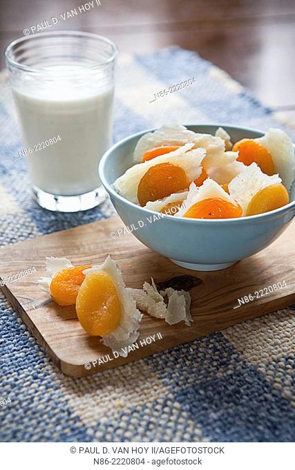 stuffed apricots with parmesan and a glass of milk - healthy snack
