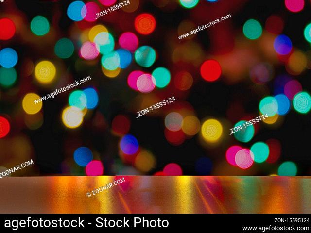 A Cup of Stella Artois full of beer with holiday colorful lights in background