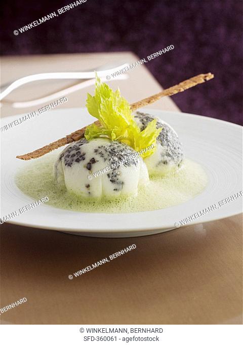 Egg white dumplings with truffle on celery foam
