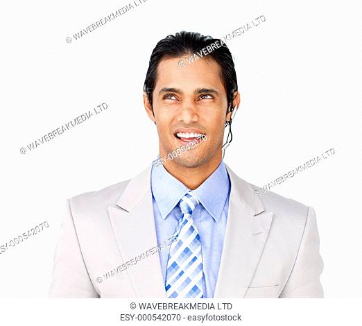 Attractive businessman with headset on against a white background