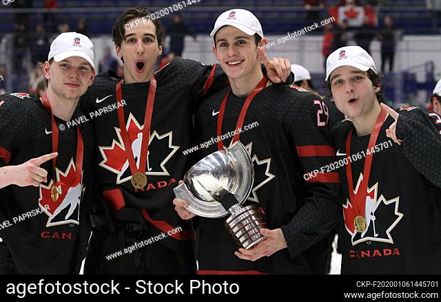 L-R Happy Canadian players Bowen Byram, Dylan Cozens, Nolan Foote and Calen Addison pose with gold medal and national flag after his team won the 2020 IIHF...