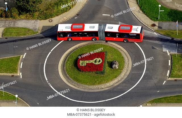 Coat of arms of the town of Velbert, bi-articulated bus in roundabout, flowerbed depicting the key in the coat of arms, Werdener Straße Friedrich-Ebert-Straße...