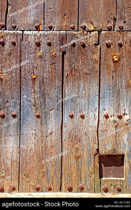 wooden door with cat gate, Gea de Albarrasí, Teruel, Spain
