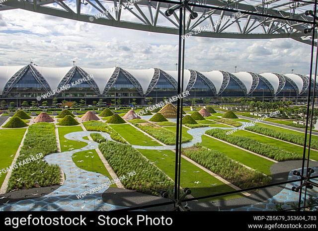 View of a terminal and a courtyard park at the Suvarnabhumi Airport, also known unofficially as Bangkok Airport, is one of two international airports serving...
