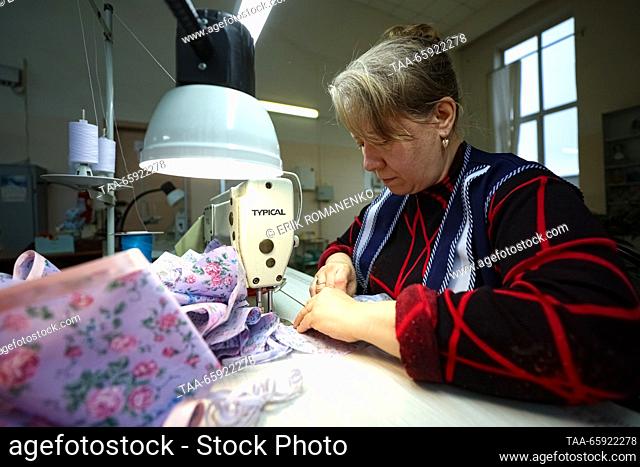 RUSSIA, VORONEZH - DECEMBER 19, 2023: An employee manufactures dolls clothes at the Igrushki toy factory. The enterprise is engaged in production of PVC...