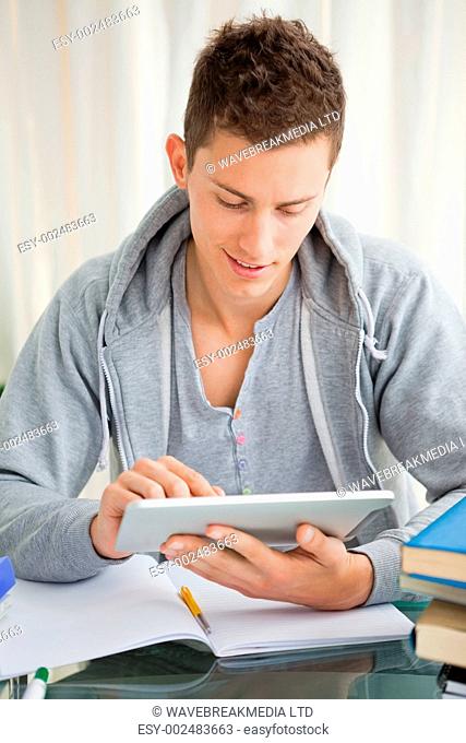 Smiling student using a touch pad