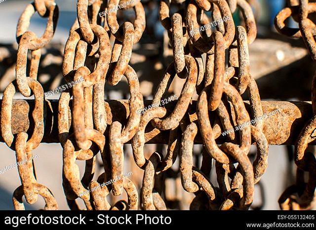 Old rusty weathered grunge iron chains closeup