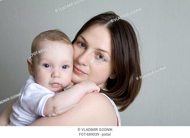 A mother holding a baby