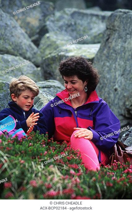 mother and son in heather, Whistler Mountain, British Columbia, Canada