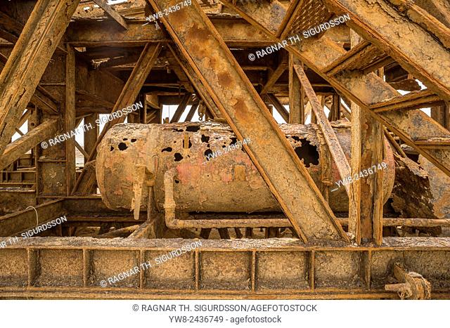 Rusting oil rig abandoned in the desert, Skeleton Coast, Namibia, Africa