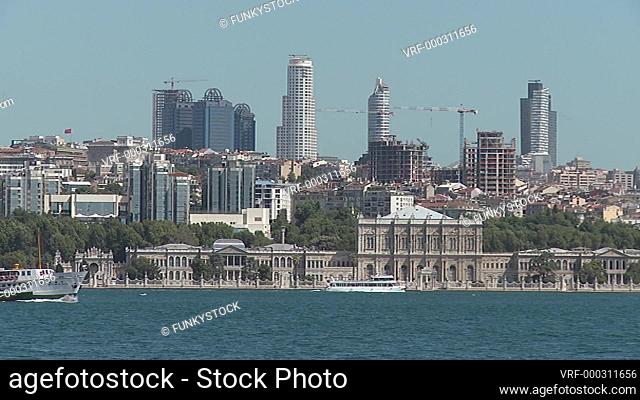 Istanbul Turkey : view across the Bosporus to the financial centre office towers with ferries passing