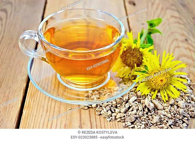 Herbal tea from root of elecampane with flower on board