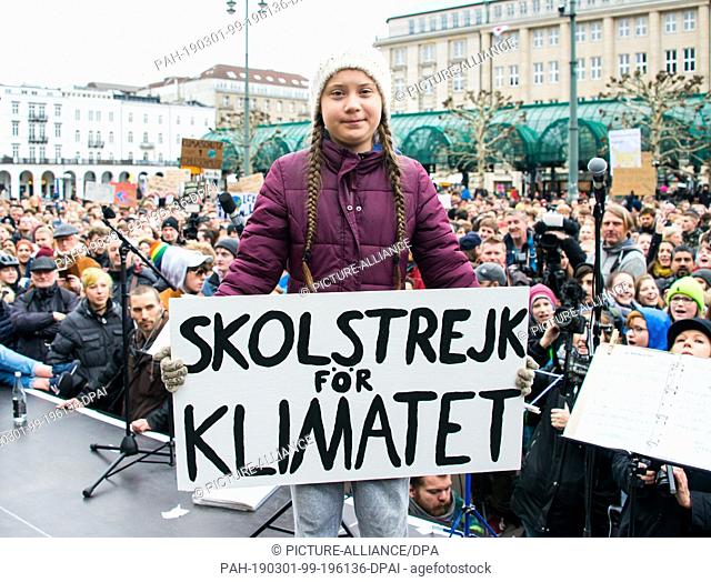 01 March 2019, Hamburg: Greta Thunberg, climate activist, stands on a stage during a rally at the town hall market. The young Swedish woman has come to Germany...