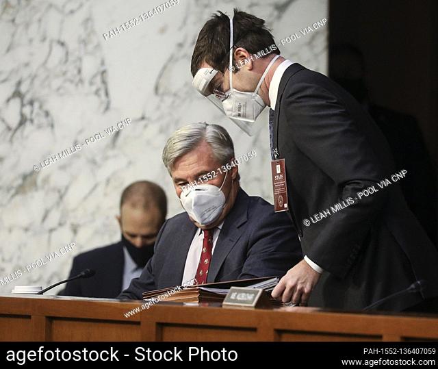 United States Senator Sheldon Whitehouse (Democrat of Rhode Island) speaks with an aide as he arrives for the second day of Senate Judiciary Committee...
