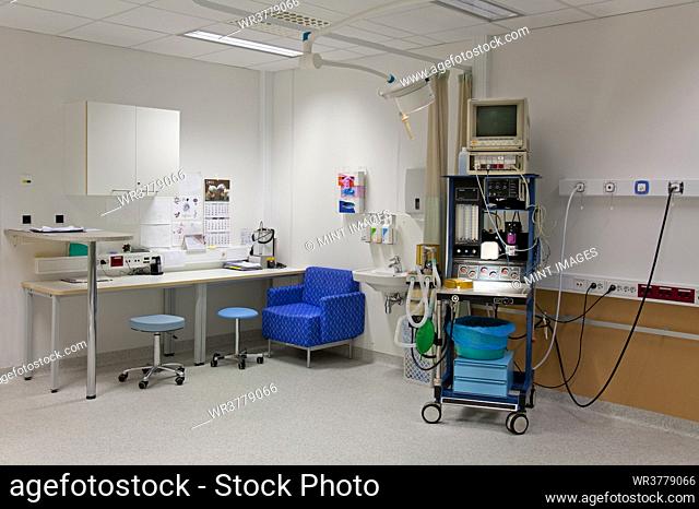 Patient faciities in a modern hospital, beds and patient bays, electronic equipment and curtains