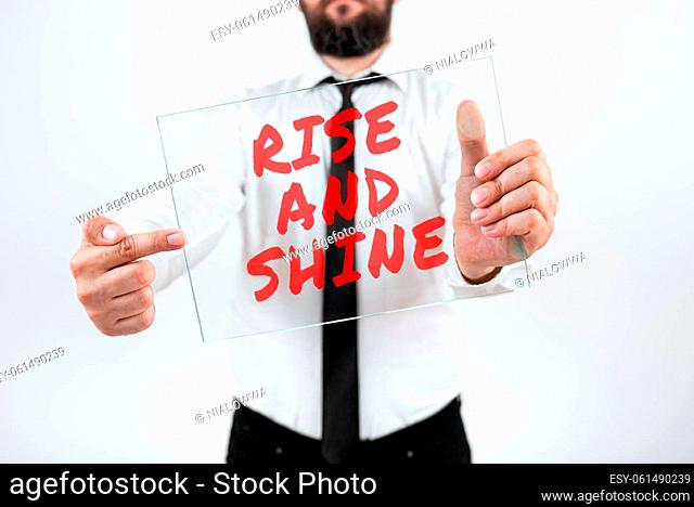 Hand writing sign Rise And Shine, Business concept Motivation for starting a new day Be bright cheerful Woman Using Virtual Reality Simulator And Gesturing...