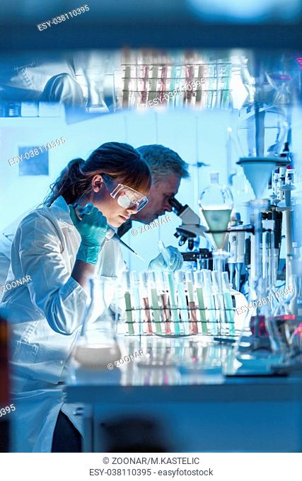 Health care researchers working in scientific laboratory