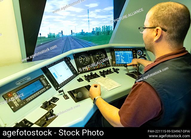 14 November 2022, Hamburg: Falco Bergner, locomotive driver DB Regio Schwerin, sits at the driver's seat of the rail simulator