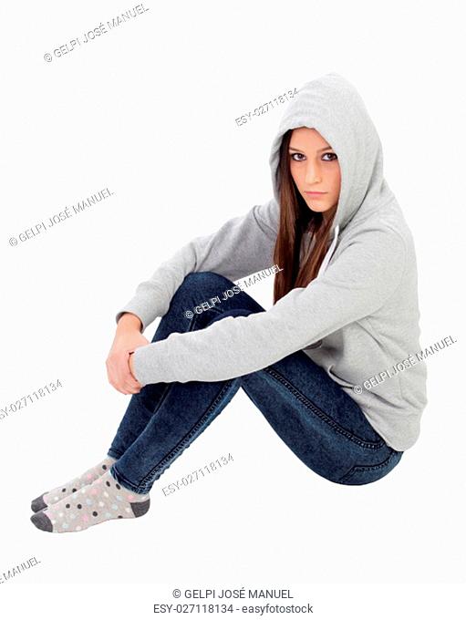 Angry hooded girl with grey sweatshirt sitting on the floor isolated