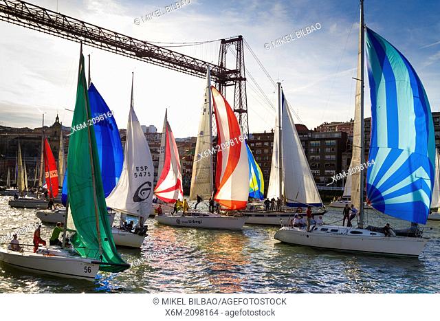 Gallo boat race and Vizcaya bridge. Mouth of Nervion river. Portugalete, Biscay, Basque Country, Spain