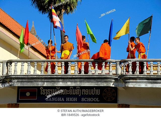 Theravada Buddhism, monks in orange robes on the balcony, convent school, Sangha High School, Wat Xayaphoum temple, Savannakhet, Laos, Southeast Asia, Asia