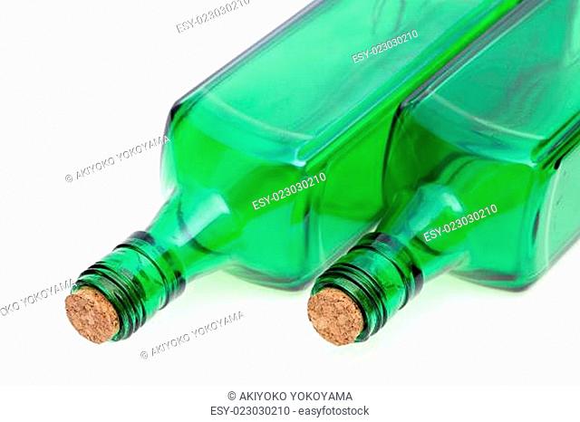 green glass bottle with cork stopper