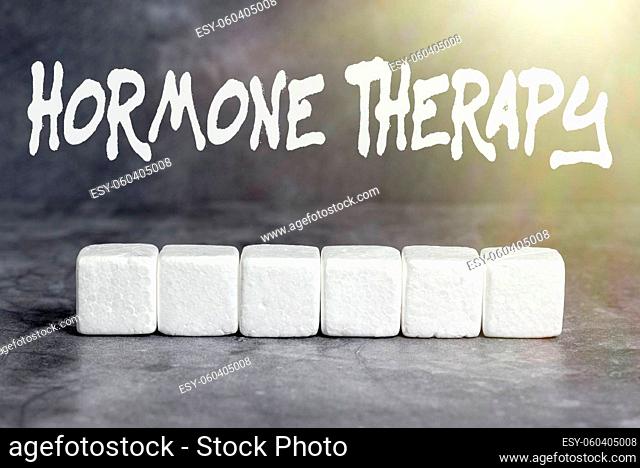Text showing inspiration Hormone Therapy, Internet Concept treatment of disease with synthetic derived hormones Stack of Sample Cube Rectangular Boxes On...