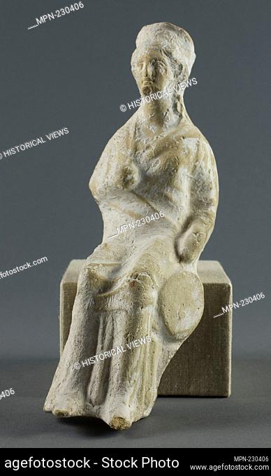 Statuette of a Seated Woman - 400/350 BC - Greek - Artist: Ancient Greek, Origin: Greece, Date: 400 BC–350 BC, Medium: Terra-cotta, Dimensions: 18