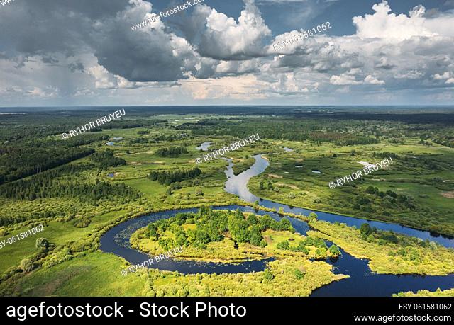 Aerial View Of Green Forest, Meadow And River Landscape In Summer Day. Top View Of European Nature From High Attitude In Summer Day