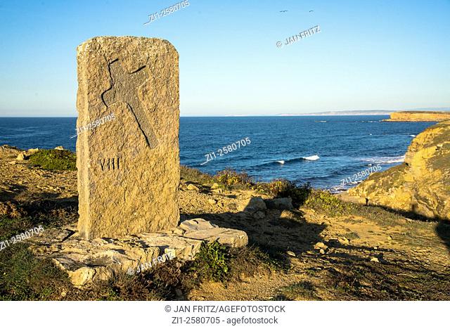 stone with cross at coast of carvoeiro at peniche in portugal
