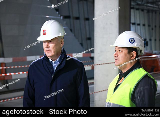 RUSSIA, MOSCOW - MARCH 20, 2023: Moscow Mayor Sergei Sobyanin (L) inspects the construction works at the Vnukovo station on Kalininsko-Solntsevskaya Line (Line...