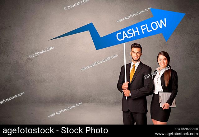 Young business person in casual holding road sign with CASH FLOW inscription, business direction concept