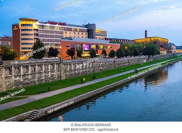 Krakow, Lesser Poland / Poland - 2018/09/08: Cracow Old Town, evening view of the Qubus hotel in the Podgorze district, by the Vistula river