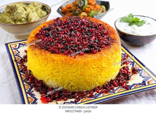 Traditional Rice Pie with Berberis and Curry as close-up on a table
