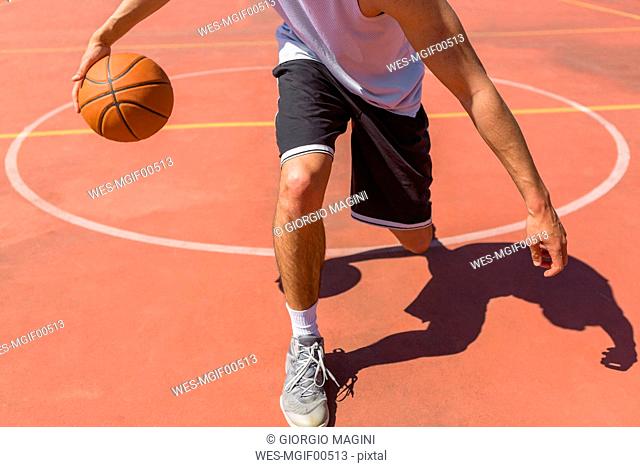 Young man playing basketball