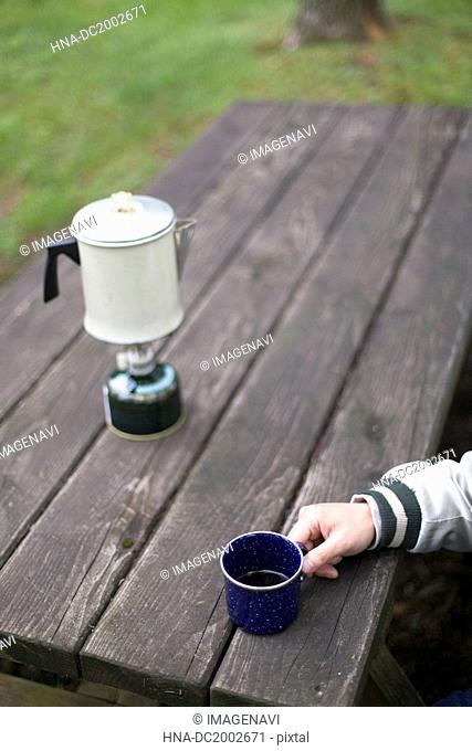 Black Coffee in Blue Mug on a Table