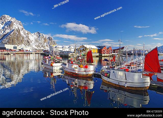 Fishing boats in harbour, snowy mountains, Svolvaer, Lofoten, Nordland, Norway, Europe