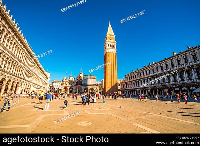 Venice, Italy - October 20, 2015 : View of tourists walking in the historic San Marco Plaza in sunny day in Venice, Italy