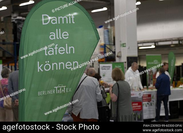 03 September 2023, Berlin: ""So that everyone can eat"" is written on the banner at a celebration of the Berliner Tafel. The 30th birthday of the social...