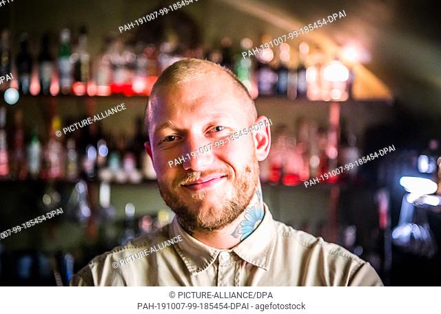 30 September 2019, Hessen, Frankfurt/Main: Michele Heinrich, bar manager, is standing in front of the bar in ""The Kinly Bar""