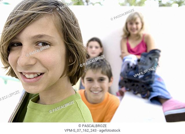 Portrait of a teenage girl smiling with her friends